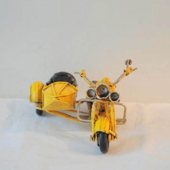 Yellow , metal, miniature retro bike with a side car