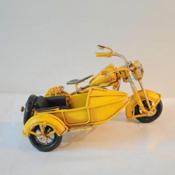 Yellow , metal, miniature retro bike with a side car