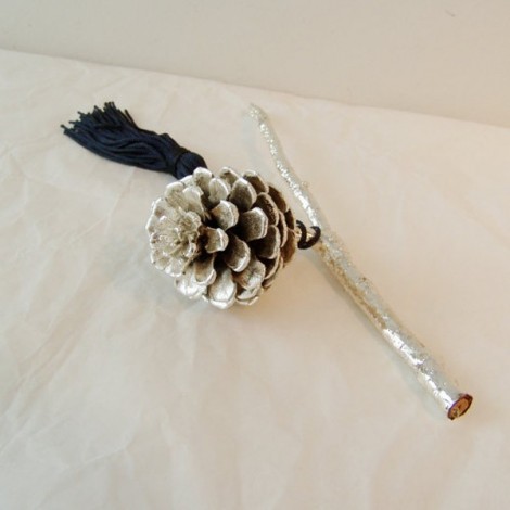 Silver pine cone on a branch, real plant silver plated. 2