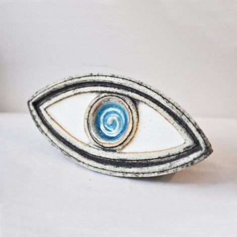 Ceramic blue eye sculpture.