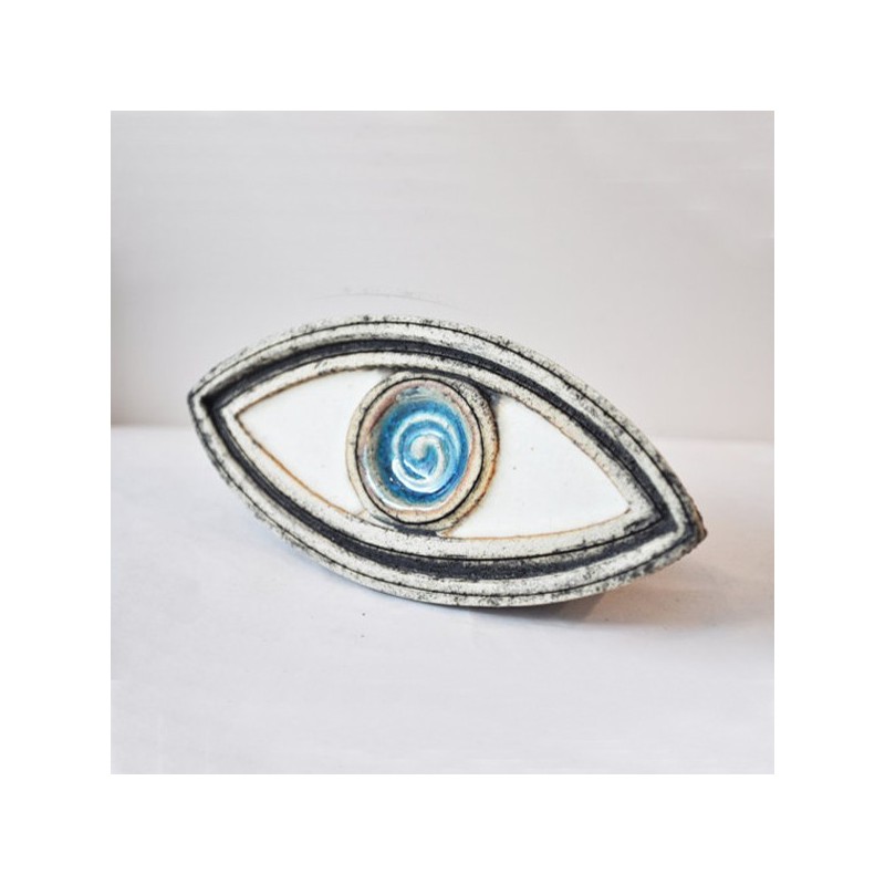 Ceramic blue eye sculpture.