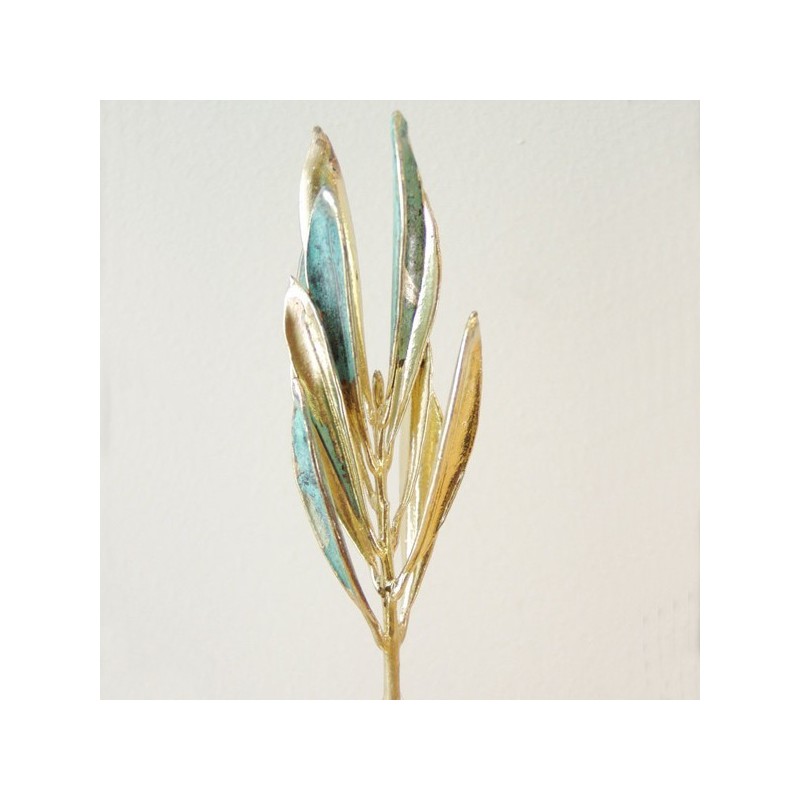 Real olive branch eco sculpture on white stone, real olive branch gold plated with 24 K gold