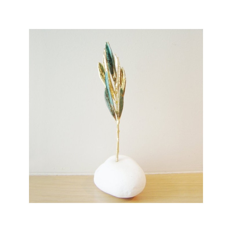 Real olive branch eco sculpture on white stone, real olive branch gold plated with 24 K gold