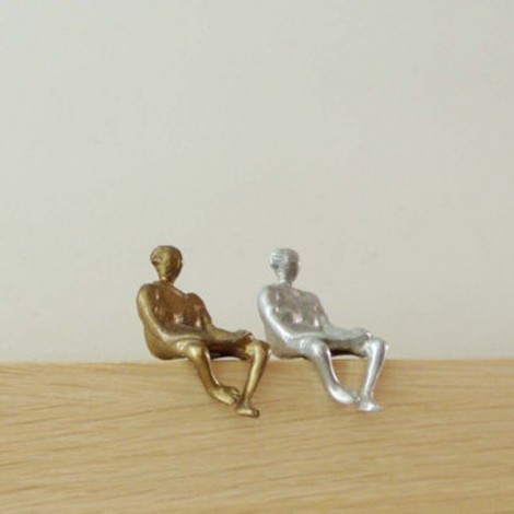 Metall sculpture of seated woman 2