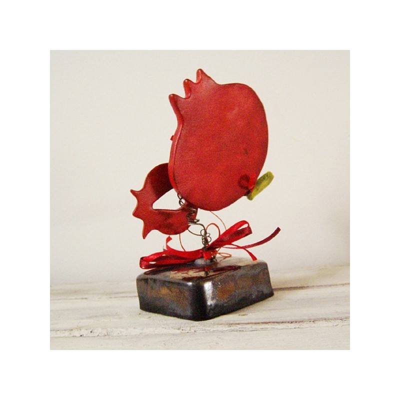 Red pomegranates sculpture, set of two pomegranates on brown, square base with green leaves and ribbons