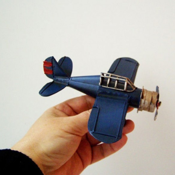 Blue metal plane, collectible miniature plane with cockpit grid and moving propeller