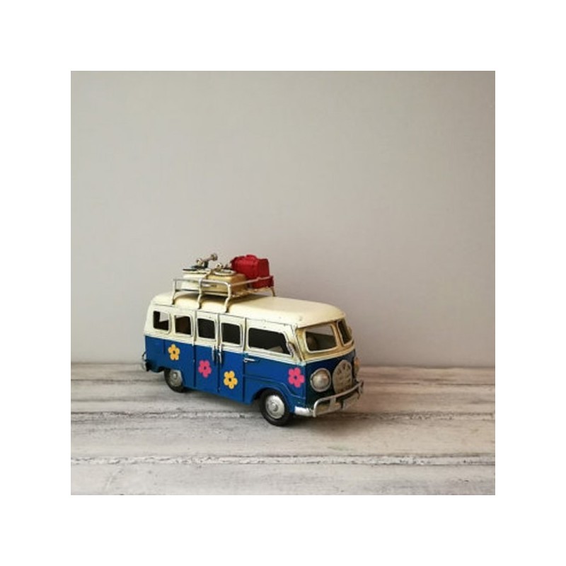 Retro VW van, hippie van in navy blue and creamy white with painted flowers and surfboards on the baggage rack