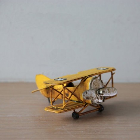 Yellow miniature aeroplane, tiny collectible biplane replica. 2