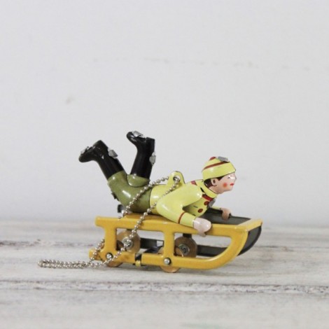Yellow sled tree ornament with child in winter clothes, yellow sled old toy style, vintage collectible miniature. 2