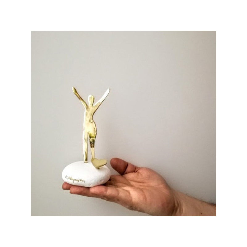 Man and heart sculpture, dancing man with heart on white marble stone, gold man figure with heart art object, Valentine's gift