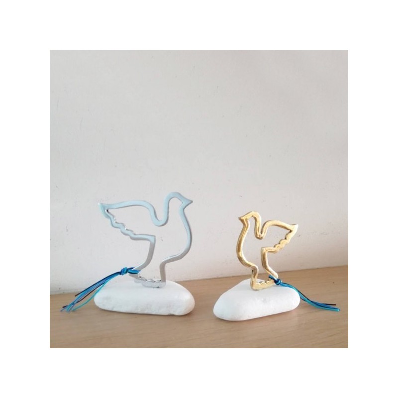 Flying bird sculpture, brass bird outline on white marble stone, gold dove sculpture on stone