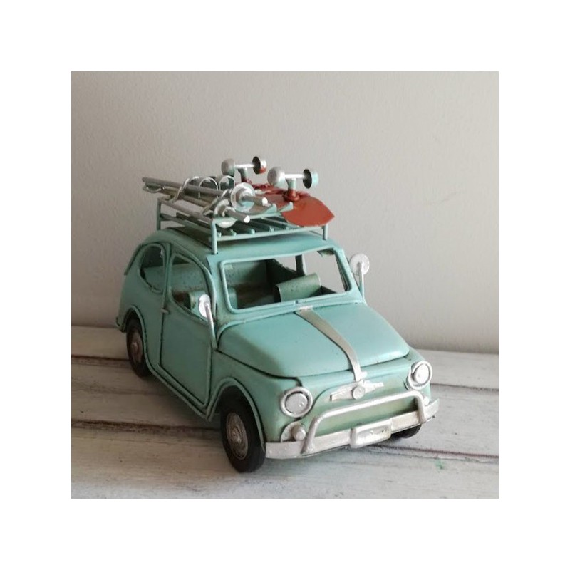 Blue Fiat car miniature with roller skates, retro collectible miniature Fiat 500 with roller skates and skis on the top