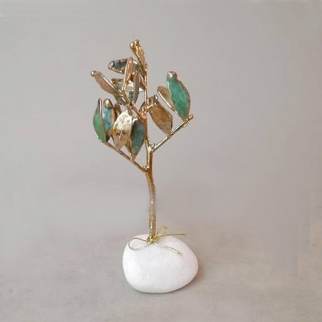 Schinus branch lucky charm, New Year's good luck charm of mastic tree twig on white pebble with 2023 charm