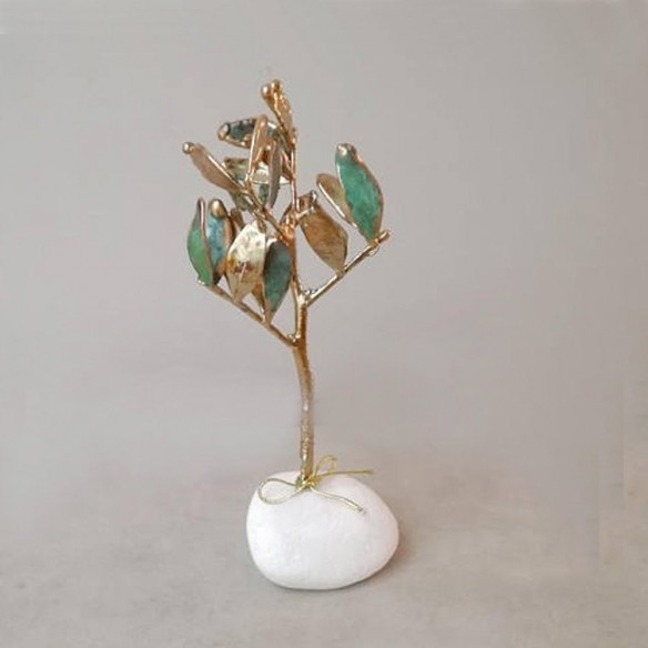 Schinus branch lucky charm, New Year's good luck charm of mastic tree twig on white pebble with 2023 charm