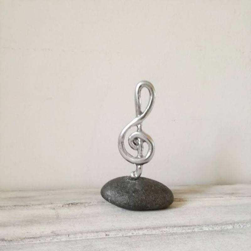 Treble clef sculpture, silver treble clef on black stone, treble clef