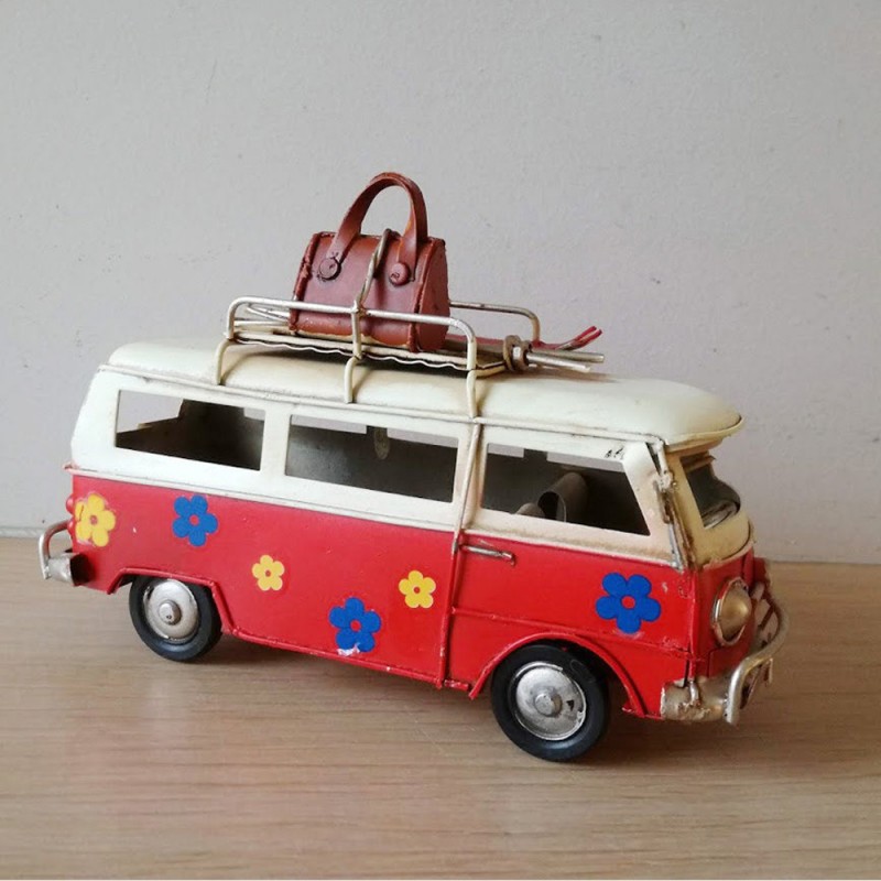 Red and white VW van, retro collectible metal VW van miniature, with two surfboards on baggage rack, collectors item