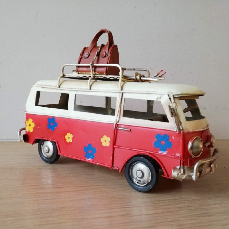 Red and white VW van, retro collectible metal VW van miniature, with two surfboards on baggage rack, collectors item
