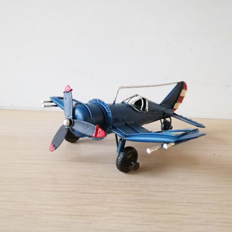 Blue metal plane, vintage, collectible miniature, retro plane with cockpit grid and moving propeller