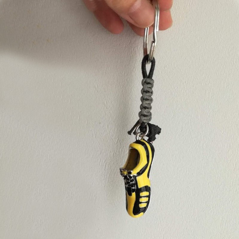 Football shoe keyring, yellow black...