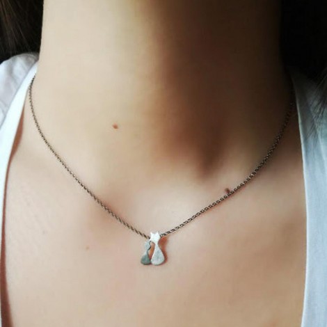 Thin, silver necklace with...