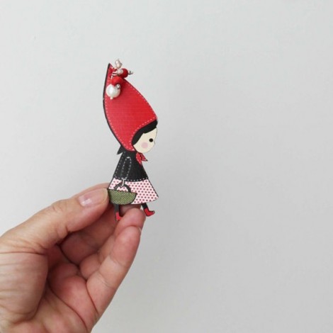 Red Riding Hood brooch, wooden brooch of Red Riding Hood in profile with long, red hood, black vest and basket in hand
