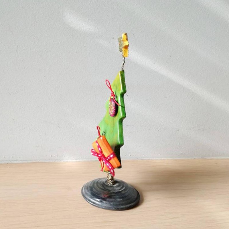 Green Chistmas tree sculpture, Xmas fir tree with red balls and sparkling star on top,