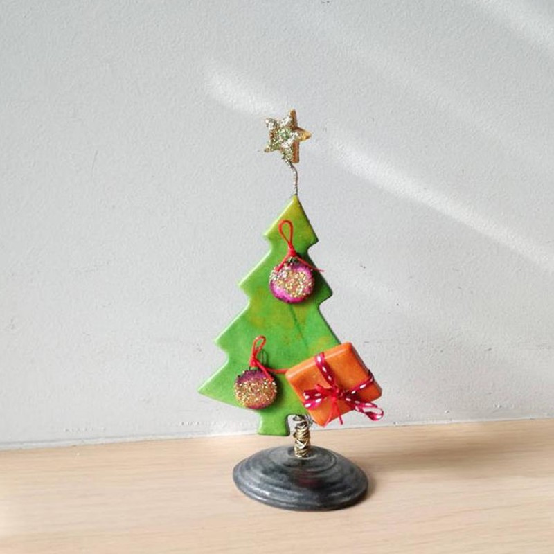 Green Chistmas tree sculpture, Xmas fir tree with red balls and sparkling star on top,