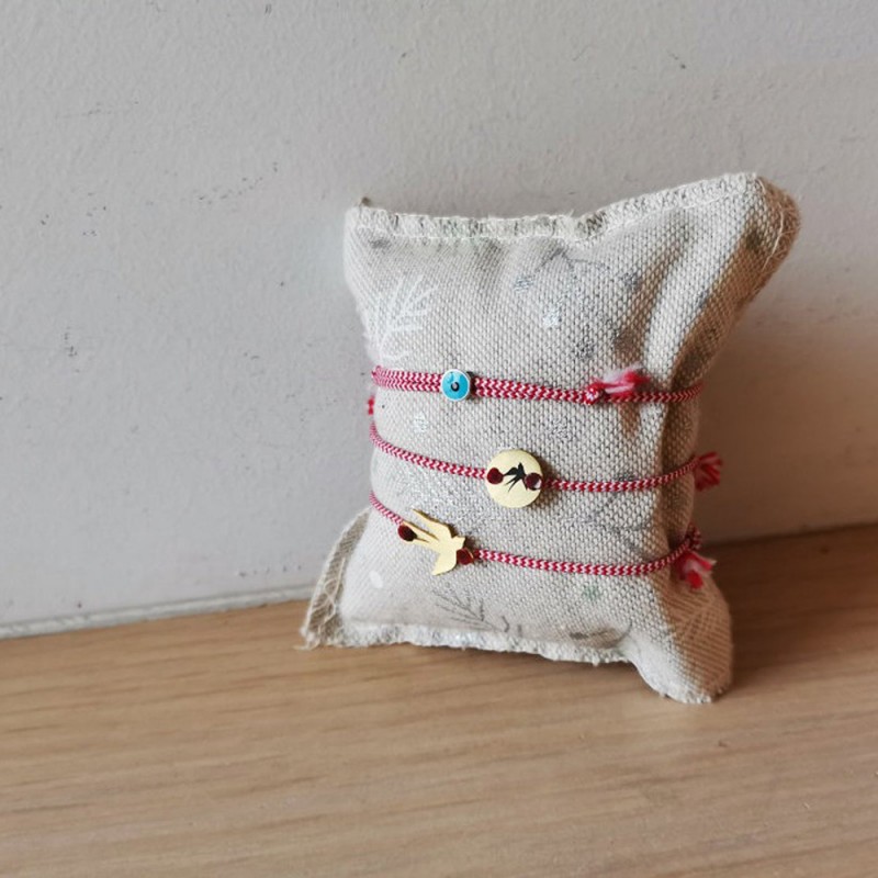 March gold bracelet, red white bracelet with various charms