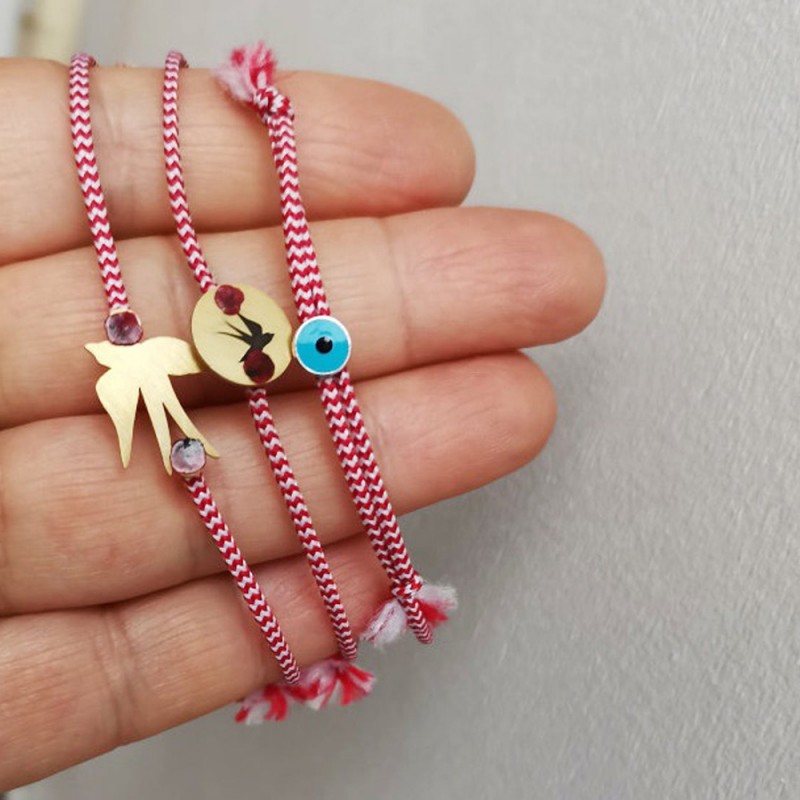 March gold bracelet, red white bracelet with various charms