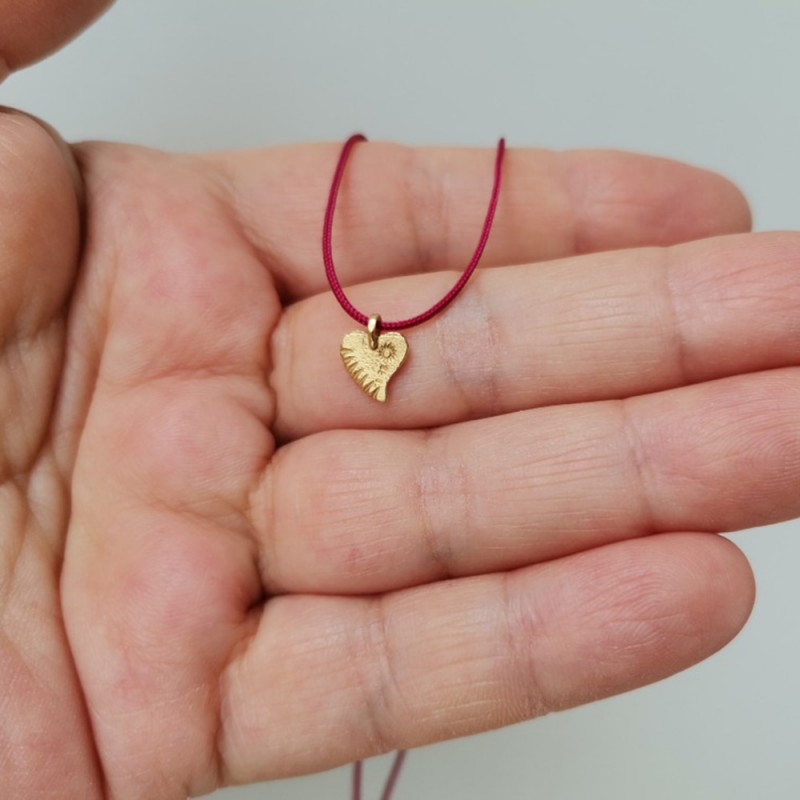 Solid gold heart necklace.