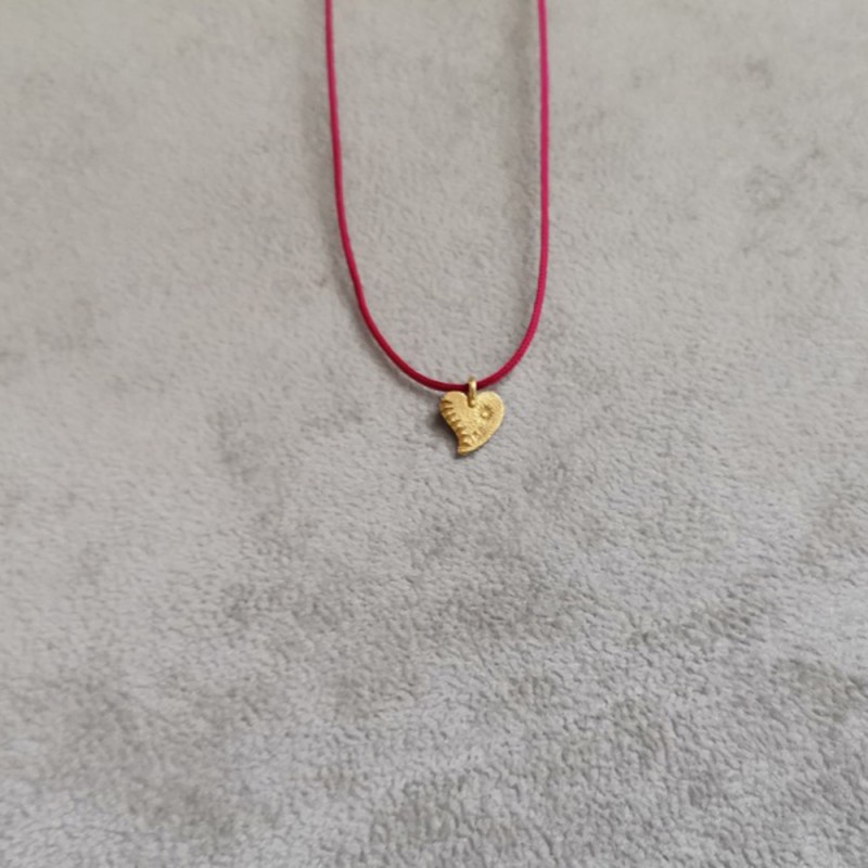 Solid gold heart necklace.