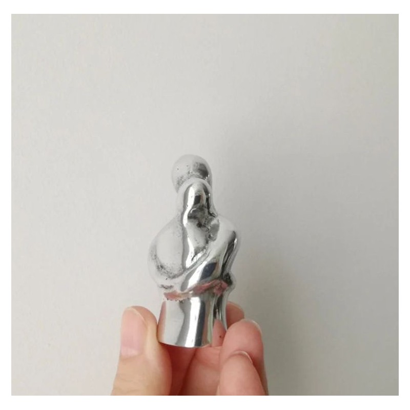 Embracing couple sculpture, abstract, minimalist sculpture of loving couple in embrace, aluminum figures, Valentine's couple gif