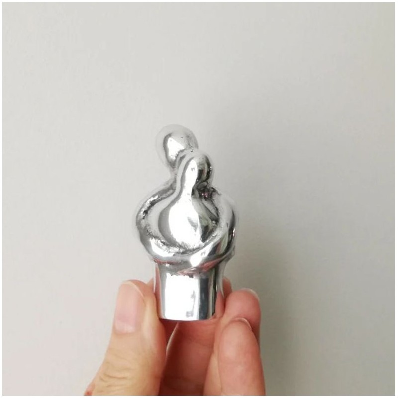 Embracing couple sculpture, abstract, minimalist sculpture of loving couple in embrace, aluminum figures, Valentine's couple gif