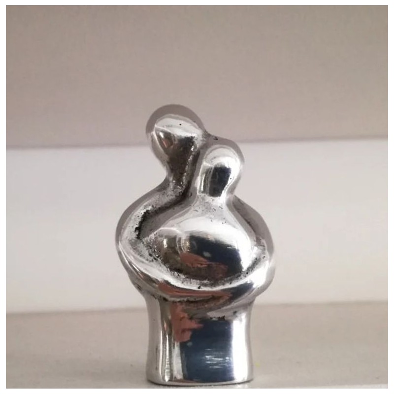 Embracing couple sculpture, abstract, minimalist sculpture of loving couple in embrace, aluminum figures, Valentine's couple gif