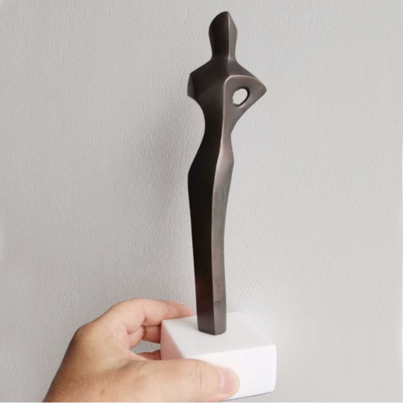 Abstract figure sculpture, solid brass, brute minimalist aesthetic, oxidised brass woman figure on marble