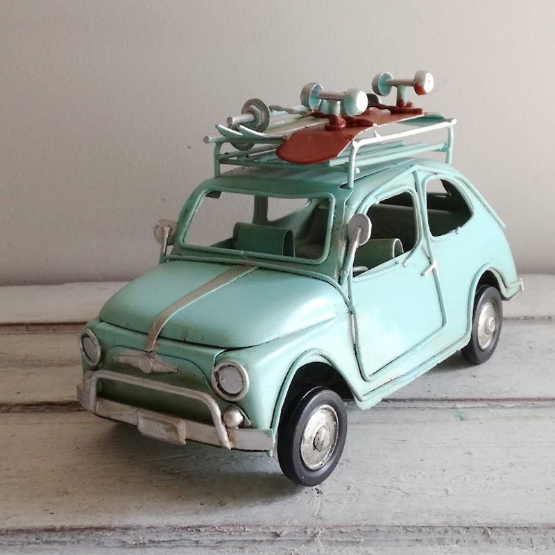 Blue Fiat car miniature with roller skates, retro collectible miniature  Fiat 500 with roller skates and skis on the top