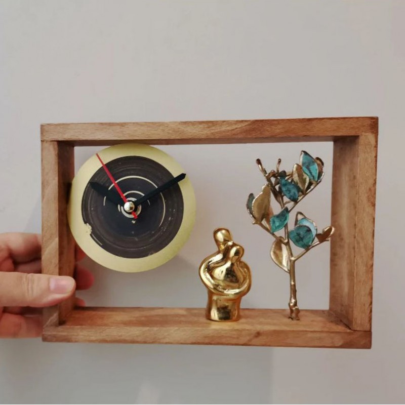 Embracing couple clock, brass figures with brass tree clock,