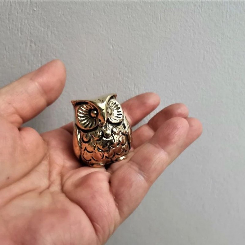 Tiny brass owl sculpture