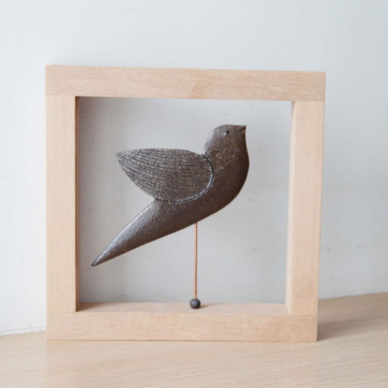 Brown bird sculpture, ceramic bird on metal stem inside wooden frame