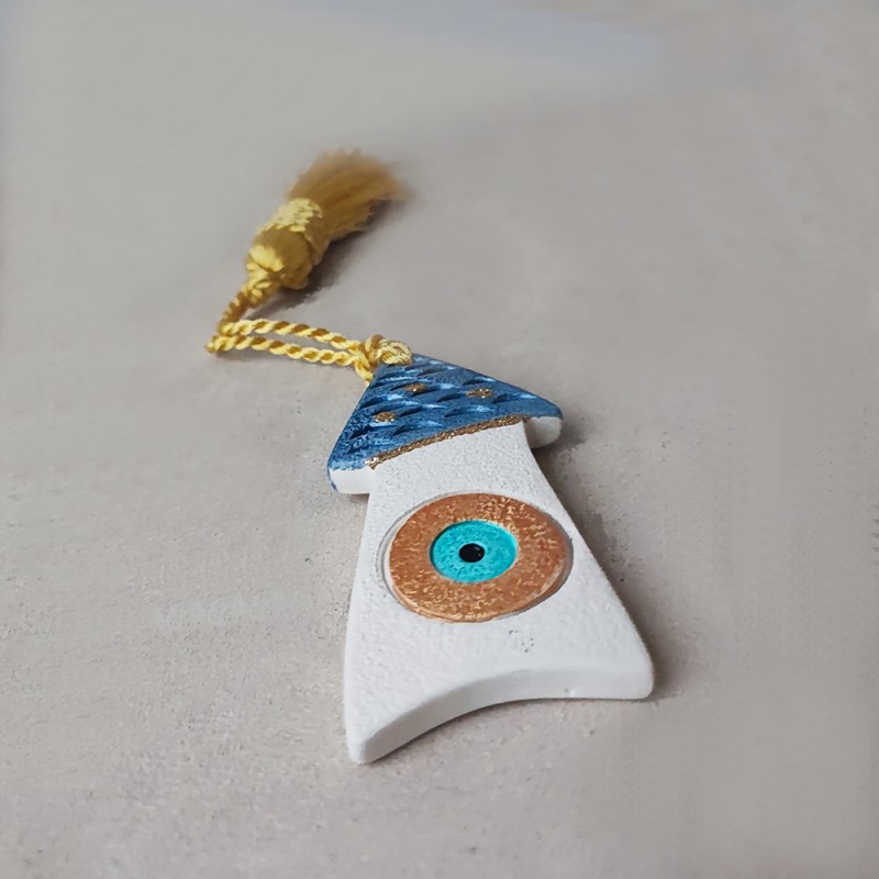 Ceramic house ornament with a tassel