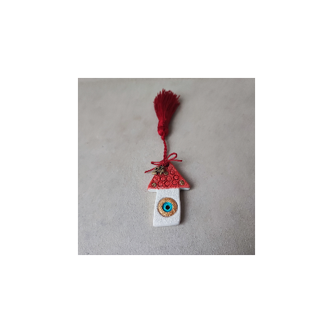 A red roof house ornament with a New Year '24 charm 2