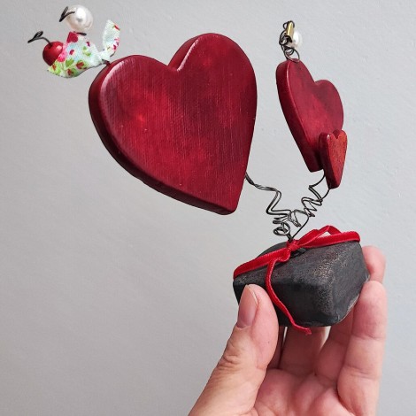 Three red ceramic hearts