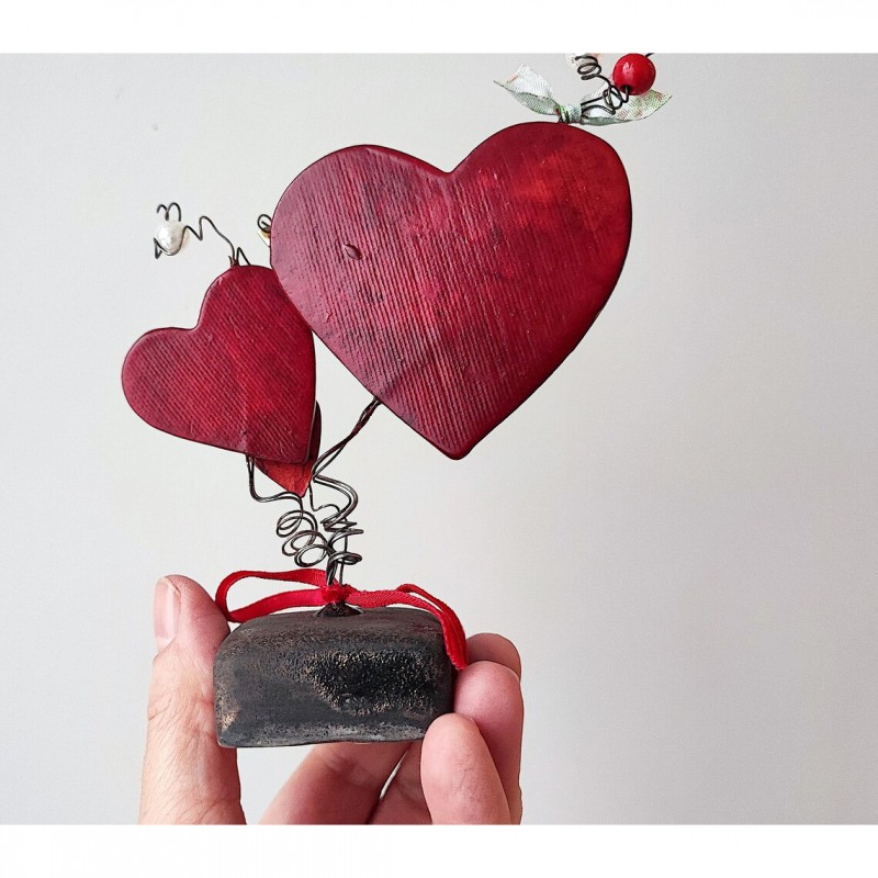 Three red ceramic hearts