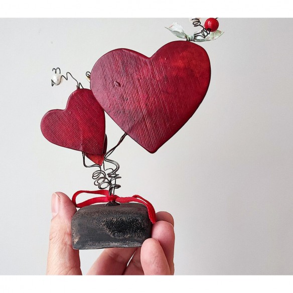 Three red ceramic hearts