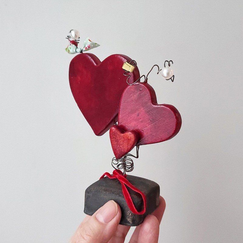 Three red ceramic hearts