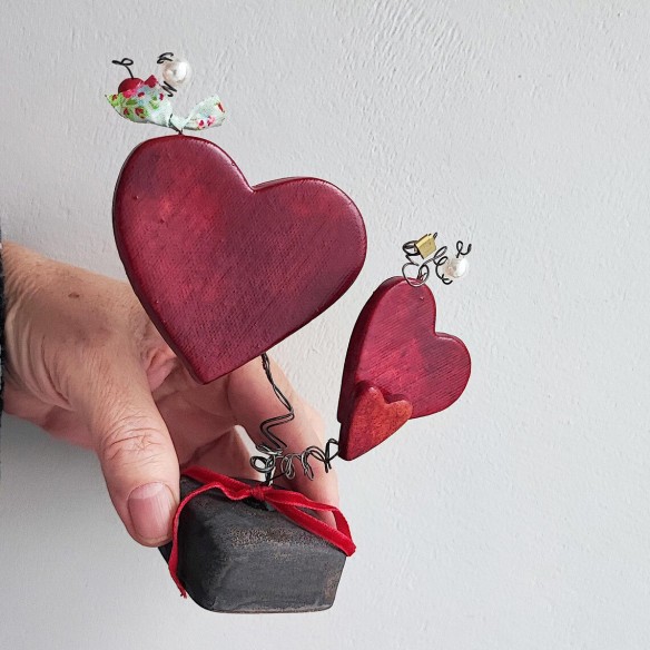 Three red ceramic hearts