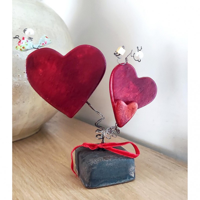 Three red ceramic hearts