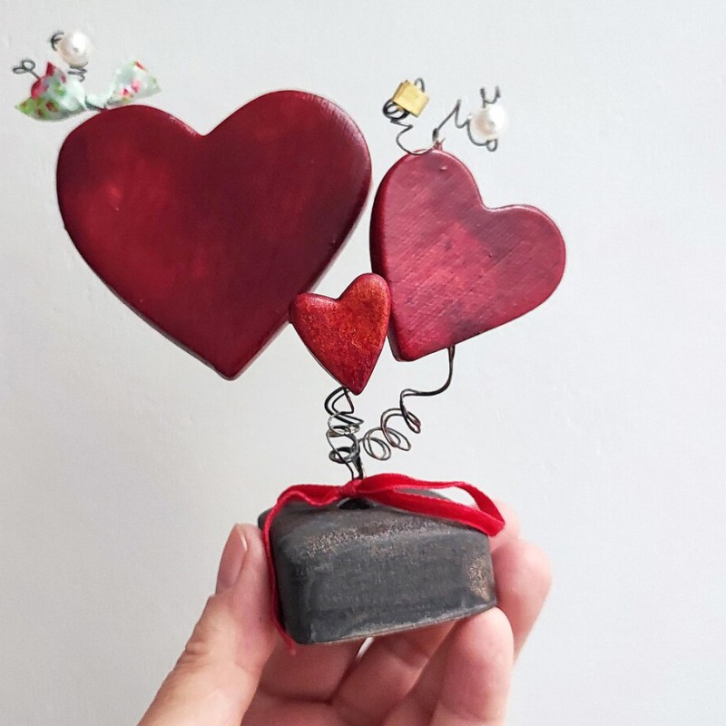 Three red ceramic hearts