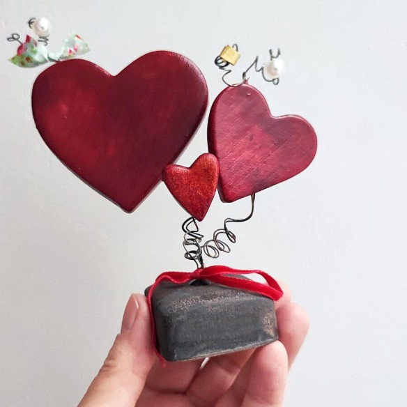 Three red ceramic hearts