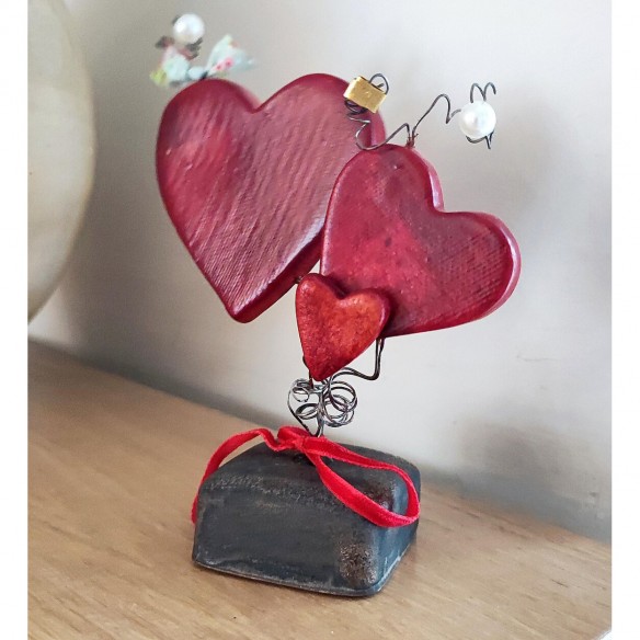 Three red ceramic hearts